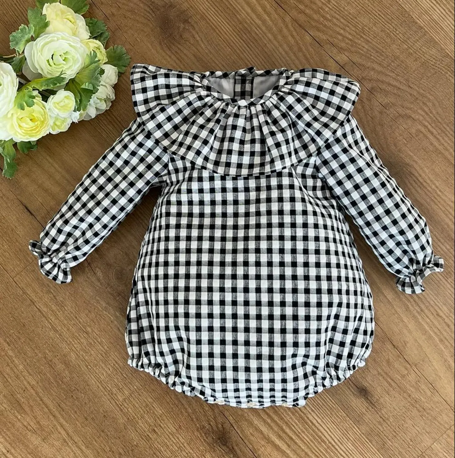 Unisex romper in black gingham box. Various sizes