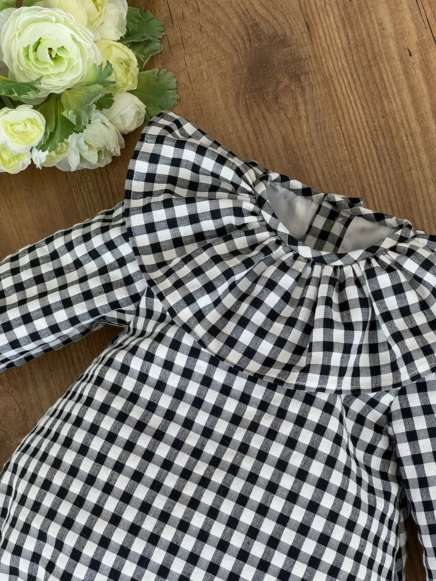 Unisex romper in black gingham box. Various sizes