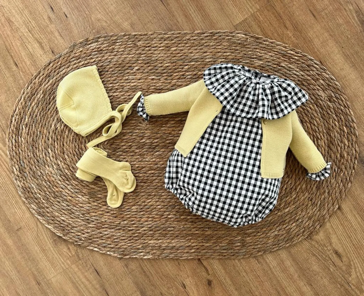 Unisex romper in black gingham box. Various sizes